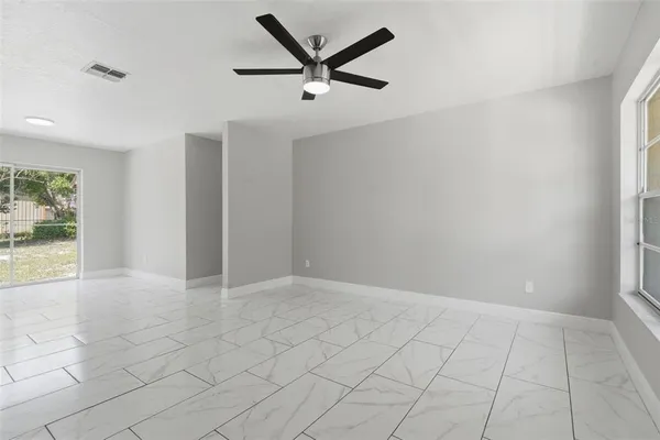 a view of an empty room with a window