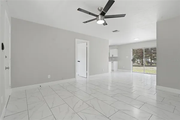a kitchen with white cabinets stainless steel appliances and sink