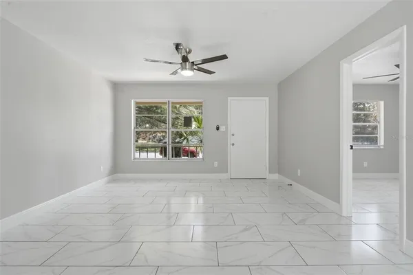 a view of an empty room with a window