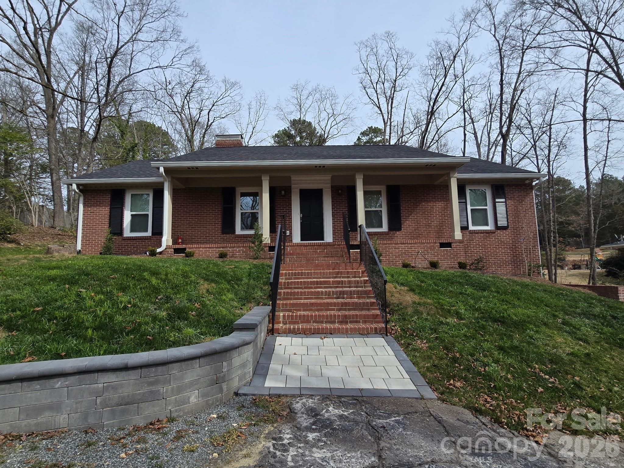 126 Sunset Drive Chester, SC 29706 - Photo 1 of 31 a front view of a house with garden