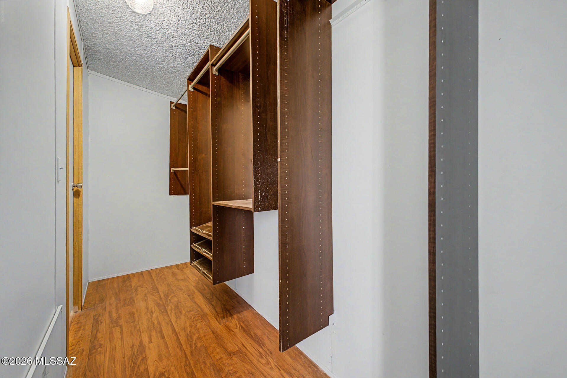 1911 West Thunder Road Vail, AZ 85641 - Photo 21 of 38 a view of hallway with wooden floor and staircase