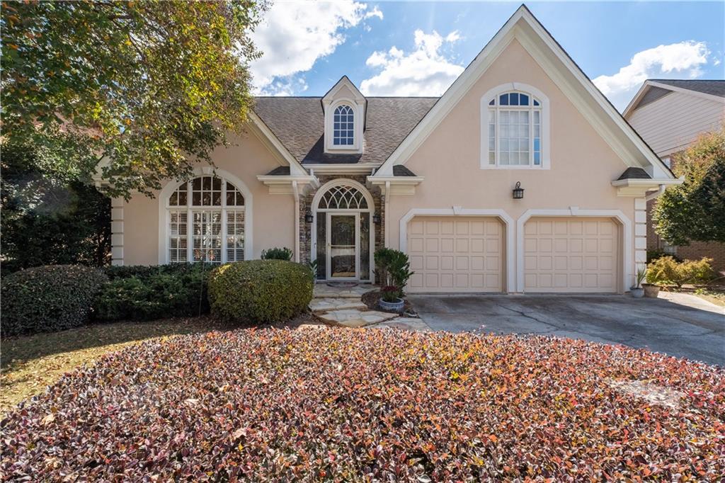 3613 Greystone Circle Chamblee, GA 30341 - Photo 1 of 53 a front view of a house with a garden