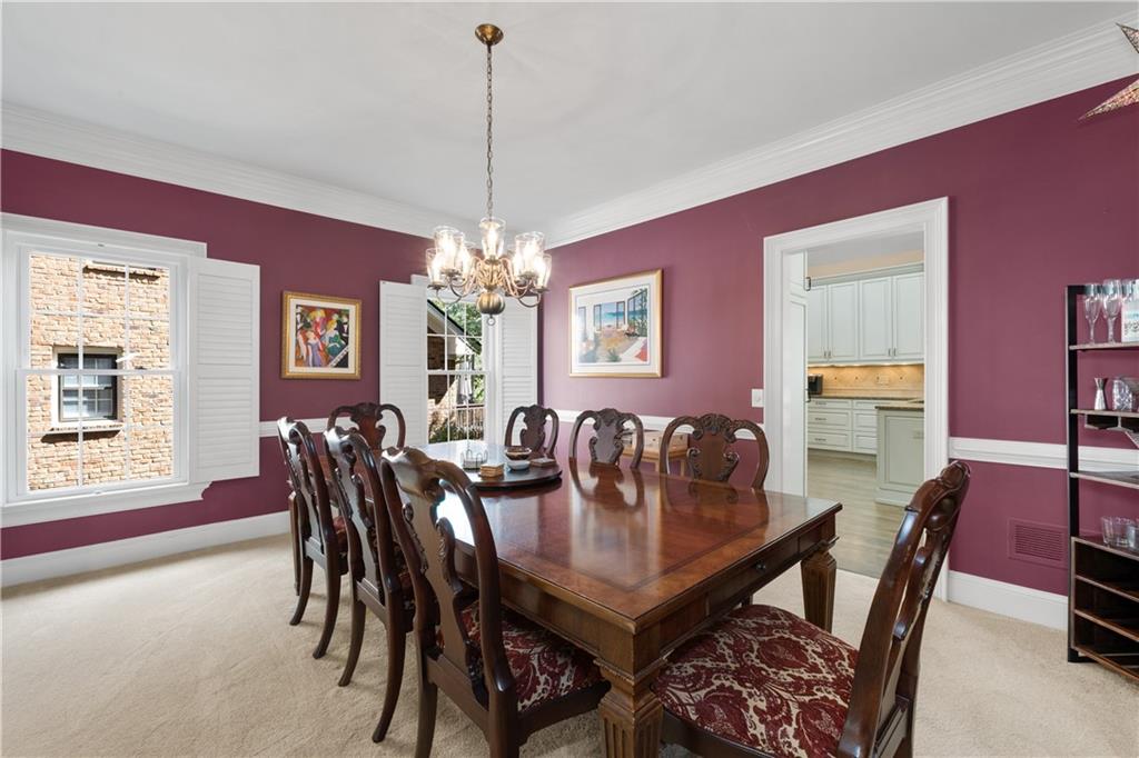3613 Greystone Circle Chamblee, GA 30341 - Photo 11 of 53 a view of a dining room with furniture and chandelier