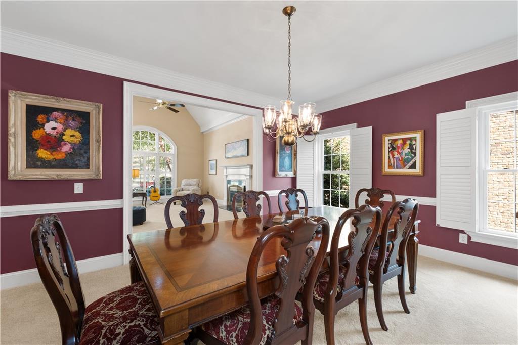 3613 Greystone Circle Chamblee, GA 30341 - Photo 12 of 53 a view of a dining room with furniture window and wooden floor