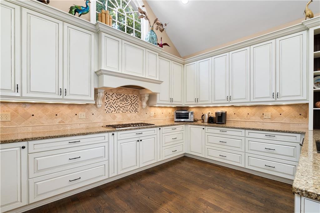3613 Greystone Circle Chamblee, GA 30341 - Photo 17 of 53 a kitchen with granite countertop white cabinets and white appliances