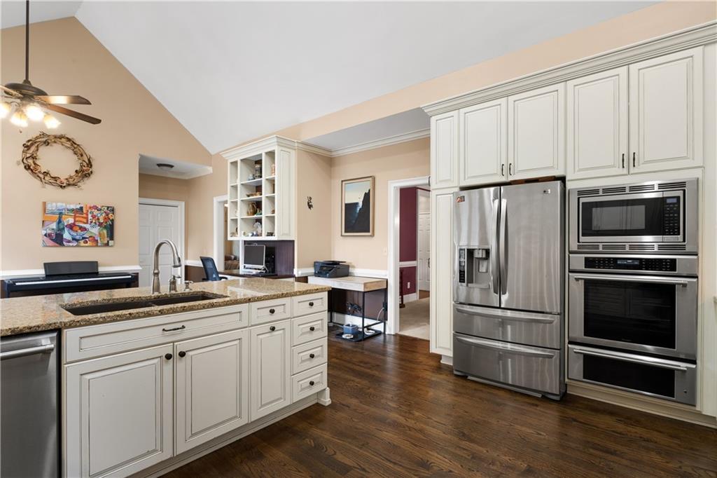 3613 Greystone Circle Chamblee, GA 30341 - Photo 19 of 53 a kitchen with a refrigerator and a stove top oven
