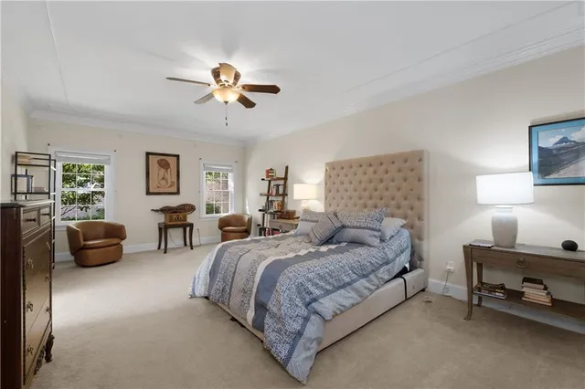 a spacious bedroom with a bed and furniture