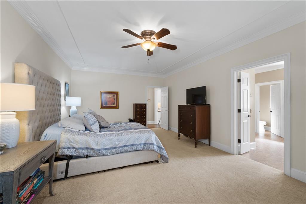 3613 Greystone Circle Chamblee, GA 30341 - Photo 25 of 53 a bedroom with a bed and a chandelier