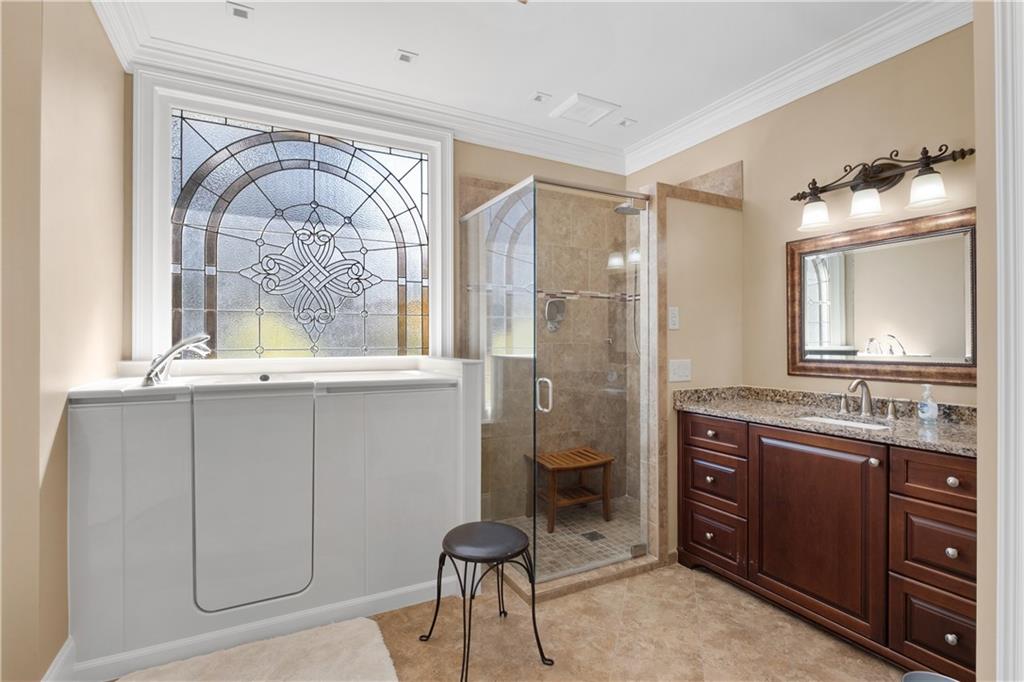 3613 Greystone Circle Chamblee, GA 30341 - Photo 26 of 53 a bathroom with a granite countertop sink a toilet and a mirror