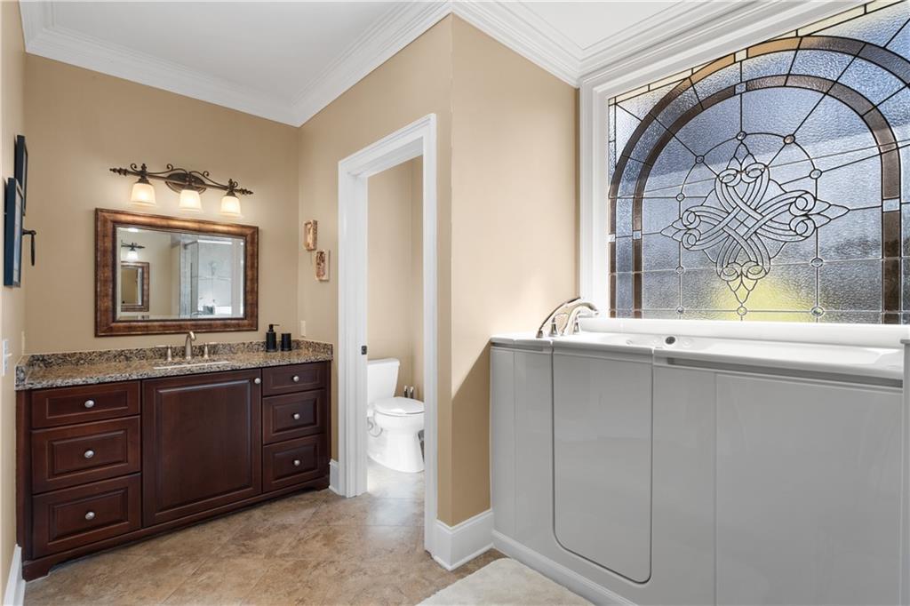 3613 Greystone Circle Chamblee, GA 30341 - Photo 27 of 53 a bathroom with a double vanity sink and mirror