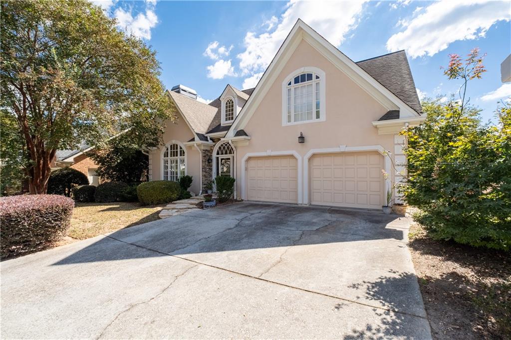 3613 Greystone Circle Chamblee, GA 30341 - Photo 3 of 53 a view of a white house with a yard and large tree