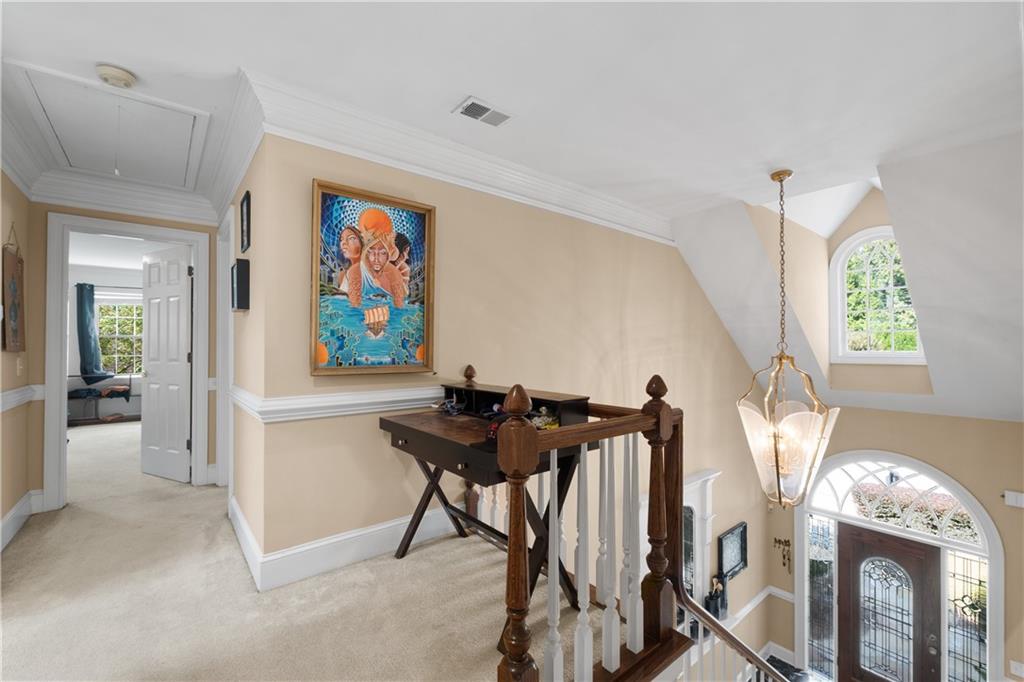 3613 Greystone Circle Chamblee, GA 30341 - Photo 32 of 53 a view of a hallway with furniture and a chandelier