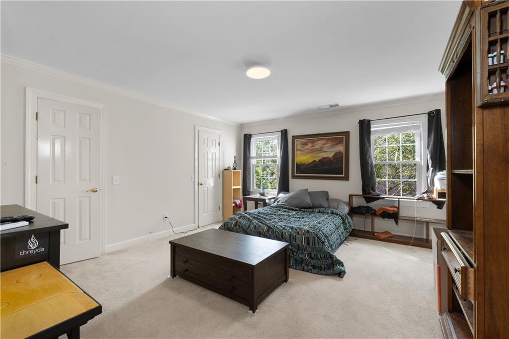 3613 Greystone Circle Chamblee, GA 30341 - Photo 36 of 53 a bed room with furniture and a window