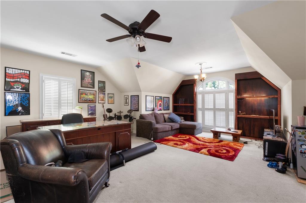 3613 Greystone Circle Chamblee, GA 30341 - Photo 38 of 53 a living room with furniture and a ceiling fan