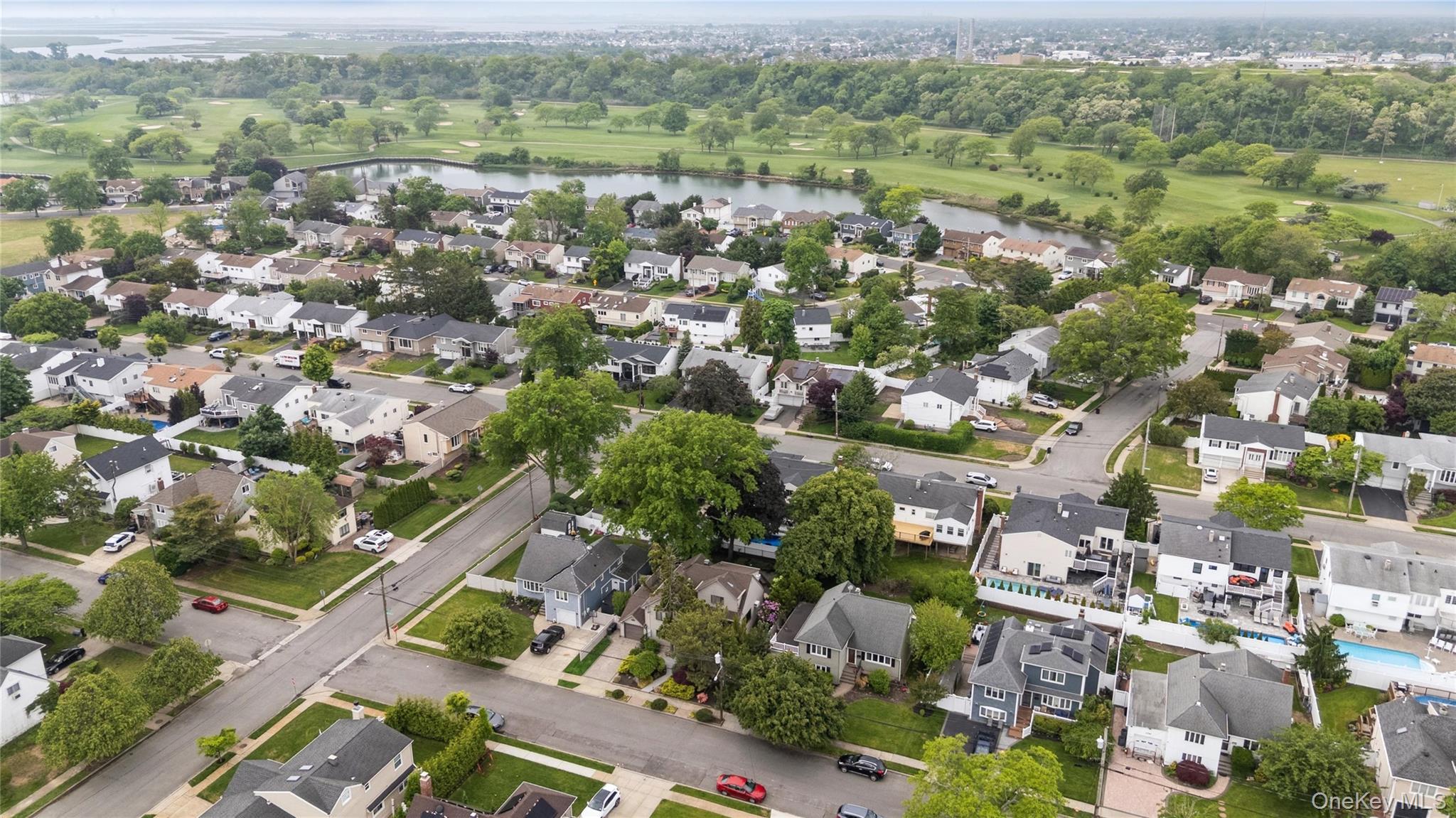2772 Riverside Avenue Merrick, NY 11566 - Photo 35 of 45 an aerial view of residential houses with outdoor space and trees