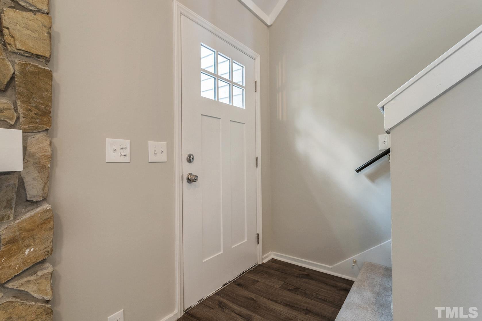 1904 Carthage Circle Raleigh, NC 27604 - Photo 11 of 25 a view of an empty room with wooden floor and a window