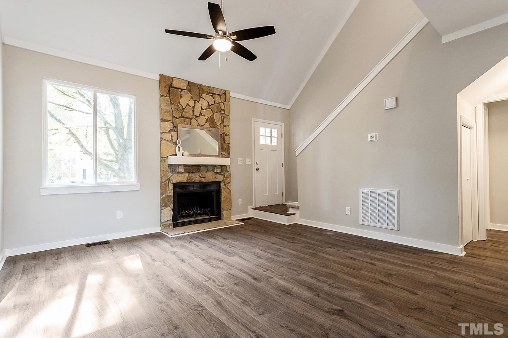1904 Carthage Circle Raleigh, NC 27604 - Photo 9 of 25 wooden floor fireplace and windows in an empty room