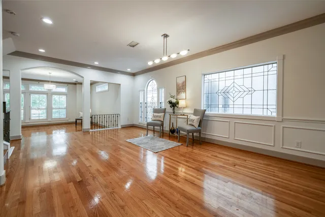 a view of a livingroom with workspace and a window