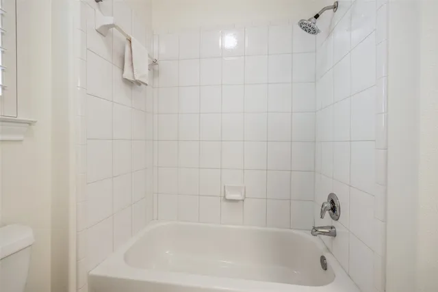 a close up of a bathtub curtain