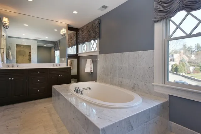 a bathroom with a bathtub and a sink