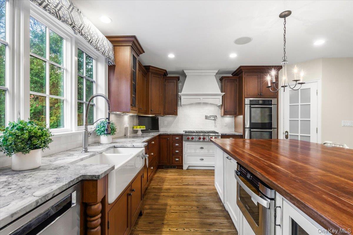 30 Lindbergh Avenue Rye, NY 10580 - Photo 13 of 36 The indoor kitchen overlooks the outdoor built in kitchen allowing for seamless indoor/outdoor entertaining.
