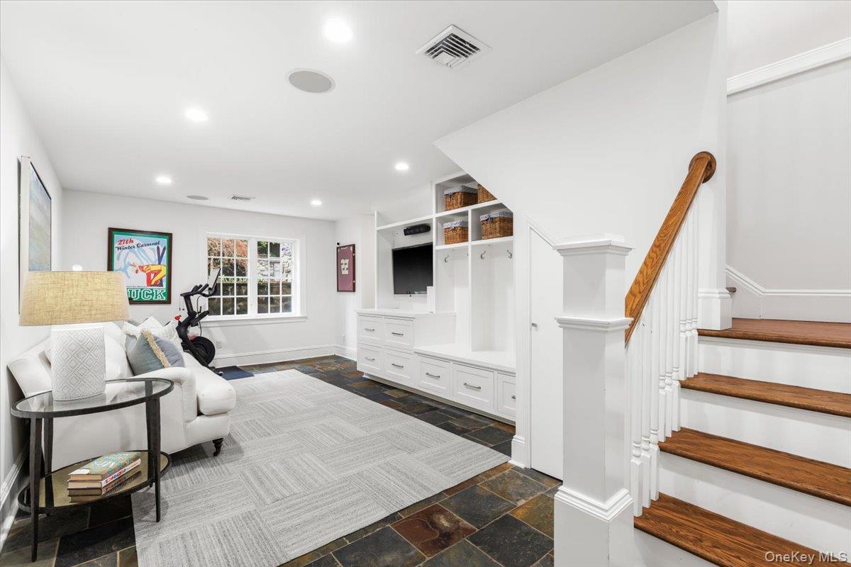 30 Lindbergh Avenue Rye, NY 10580 - Photo 25 of 36 Lower level recreation room/gym/mudroom space, conveniently located off the attached garage.