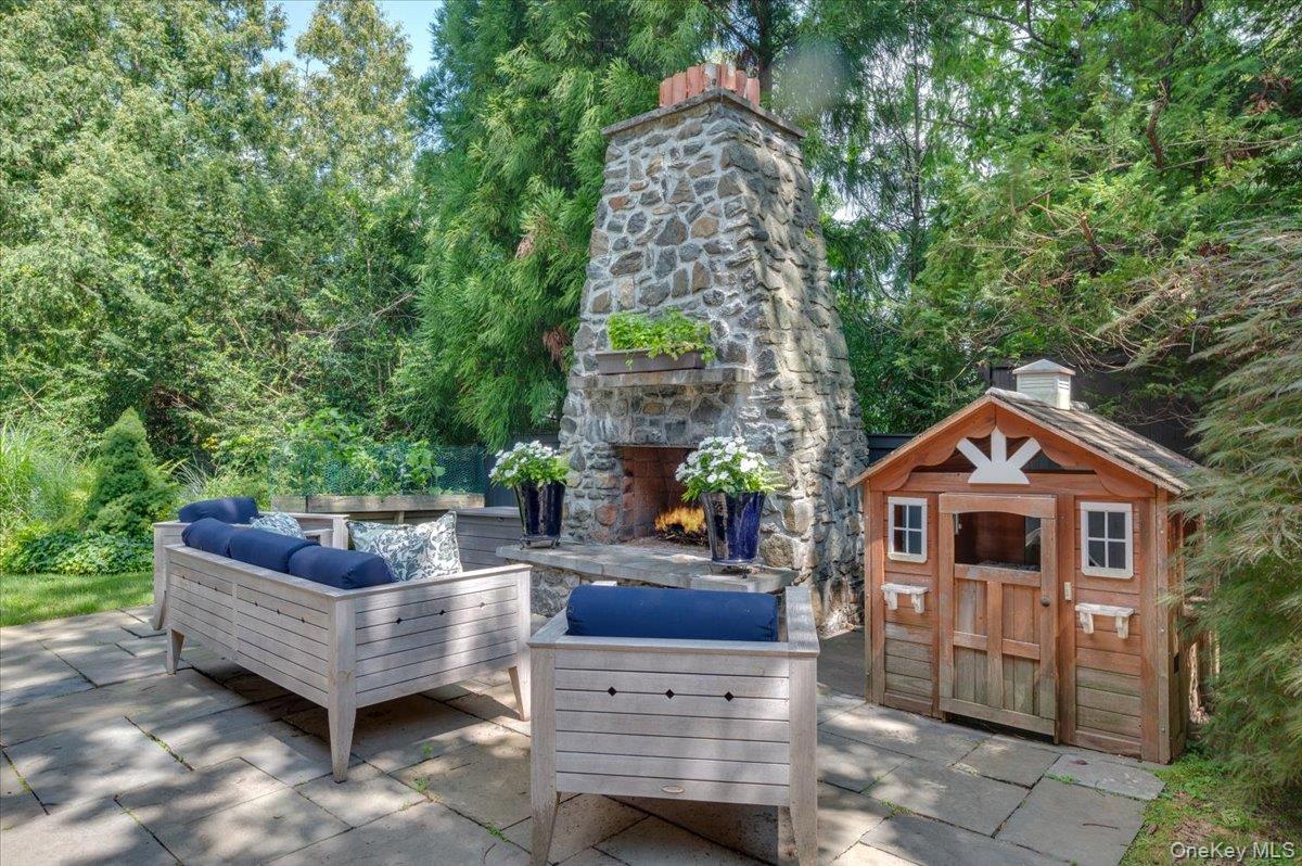 30 Lindbergh Avenue Rye, NY 10580 - Photo 29 of 36 An outdoor stone fireplace is the perfect spot to relax on a chilly evening!