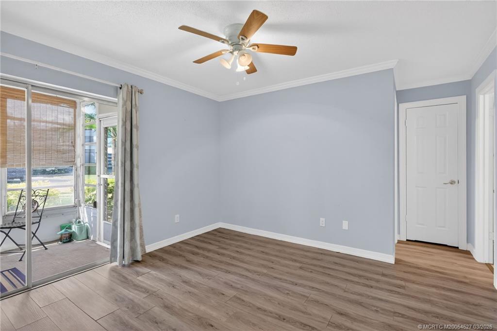 2929 Southeast Ocean Boulevard, Unit J3 Stuart, FL 34996 - Photo 24 of 65 wooden floor in an empty room with a window