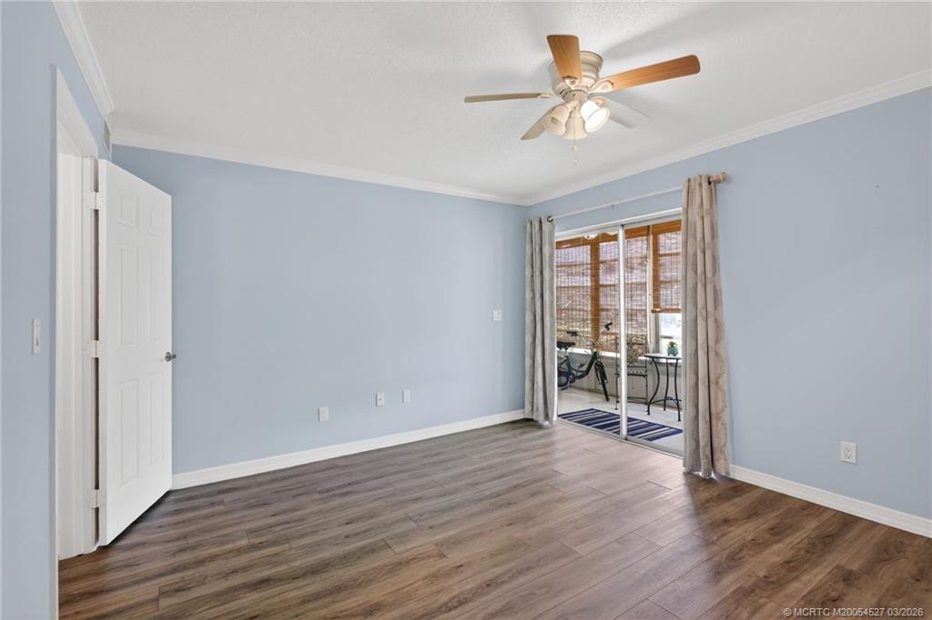 2929 Southeast Ocean Boulevard, Unit J3 Stuart, FL 34996 - Photo 27 of 65 wooden floor in an empty room with a window