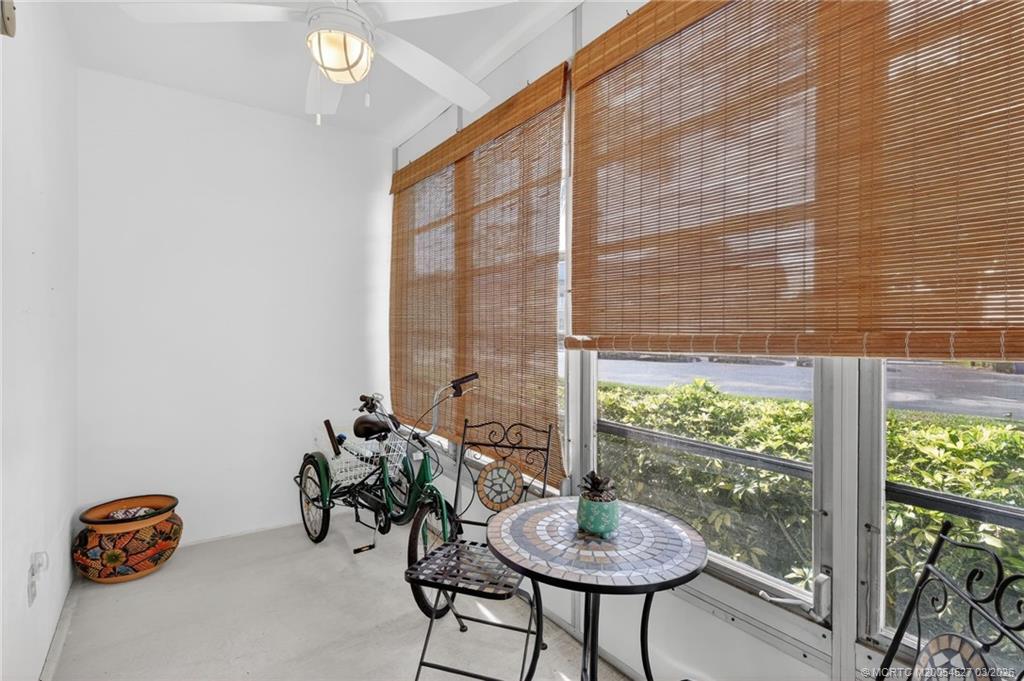 2929 Southeast Ocean Boulevard, Unit J3 Stuart, FL 34996 - Photo 32 of 65 a room with furniture and a potted plant