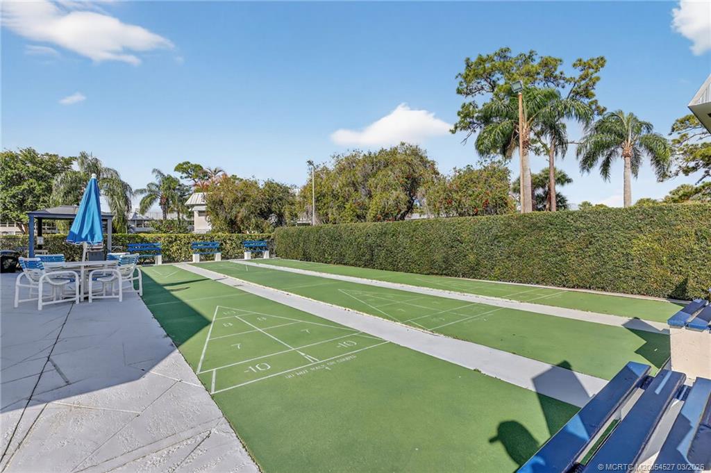 2929 Southeast Ocean Boulevard, Unit J3 Stuart, FL 34996 - Photo 41 of 65 a view of a tennis court