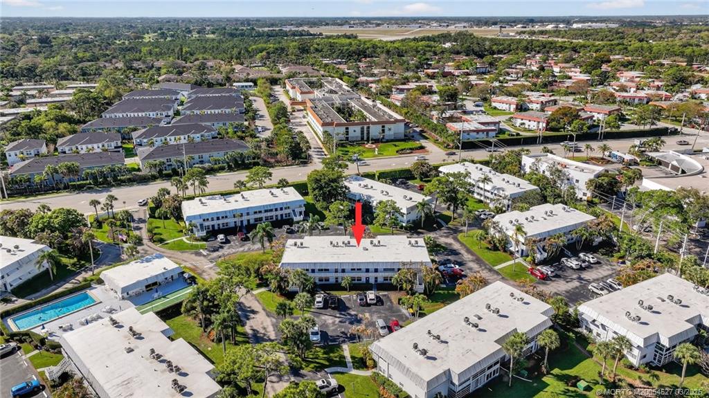 2929 Southeast Ocean Boulevard, Unit J3 Stuart, FL 34996 - Photo 50 of 65 an aerial view of a city with lots of residential buildings
