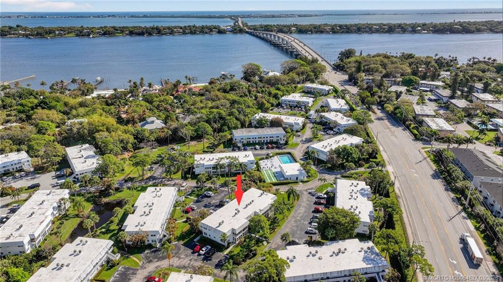 2929 Southeast Ocean Boulevard, Unit J3 Stuart, FL 34996 - Photo 52 of 65 an aerial view of a house with a lake view