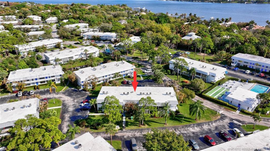 2929 Southeast Ocean Boulevard, Unit J3 Stuart, FL 34996 - Photo 58 of 65 an aerial view of a houses with outdoor space