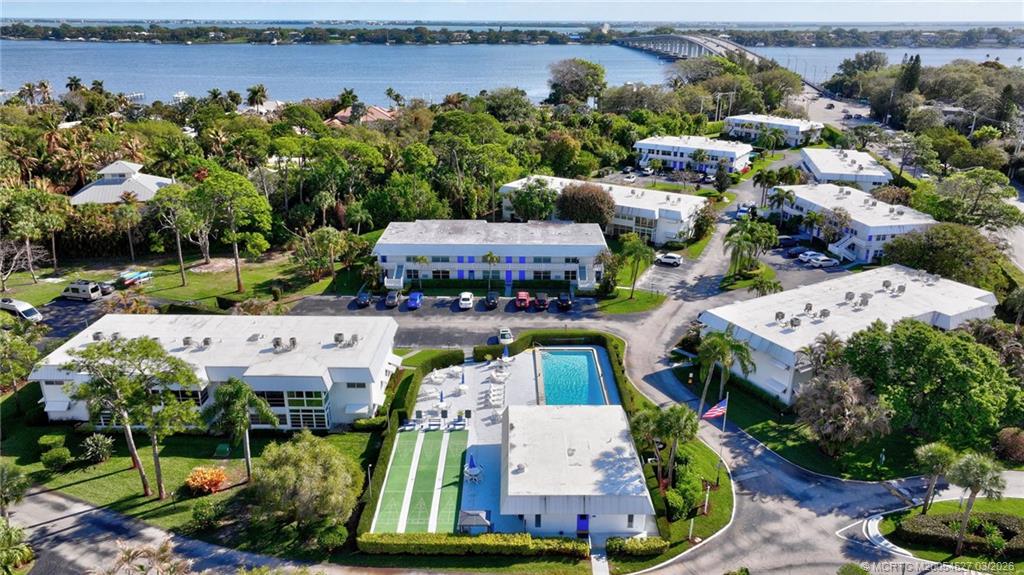 2929 Southeast Ocean Boulevard, Unit J3 Stuart, FL 34996 - Photo 59 of 65 an aerial view of a house with swimming pool and outdoor seating