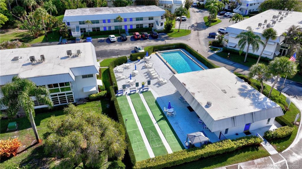 2929 Southeast Ocean Boulevard, Unit J3 Stuart, FL 34996 - Photo 60 of 65 an aerial view of a house with garden space and street view