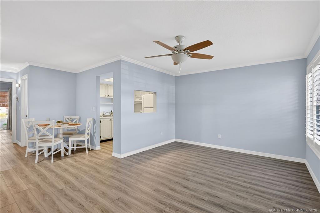 2929 Southeast Ocean Boulevard, Unit J3 Stuart, FL 34996 - Photo 8 of 65 a view of a livingroom with furniture and wooden floor