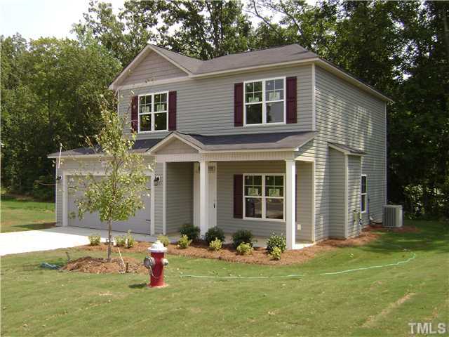 6500 Horseback Lane Raleigh, NC 27610 - Photo 1 of 7 a front view of house with yard outdoor seating and green space