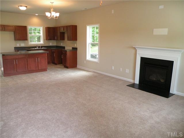 6500 Horseback Lane Raleigh, NC 27610 - Photo 3 of 7 a large kitchen with a fireplace and a sink