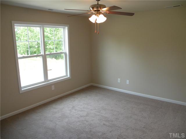 6500 Horseback Lane Raleigh, NC 27610 - Photo 6 of 7 an empty room with a window