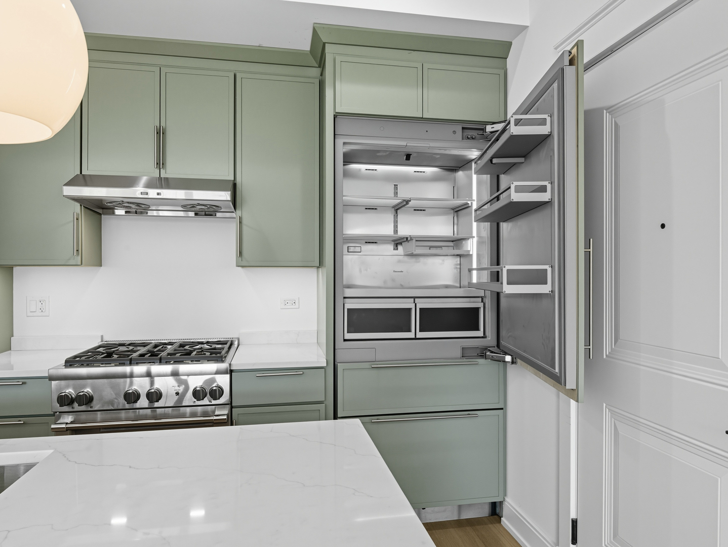 2471 North Clybourn Avenue, Unit 3 Chicago, IL 60614 - Photo 4 of 19 a kitchen with a refrigerator and a stove