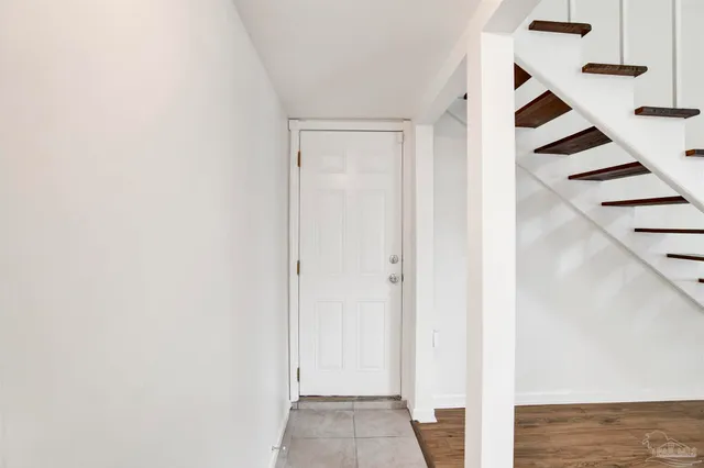 a view of entryway with wooden floor