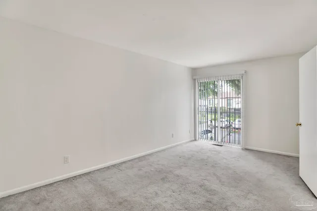 a view of a livingroom and an empty room