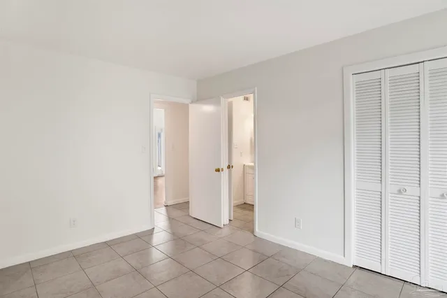 a backyard of a house with palm trees