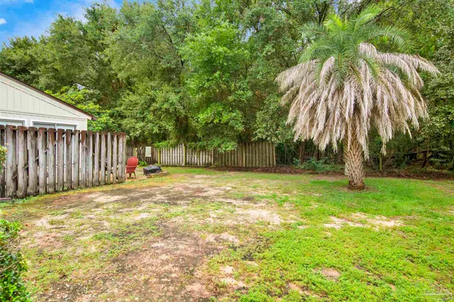 a view of a backyard of the house