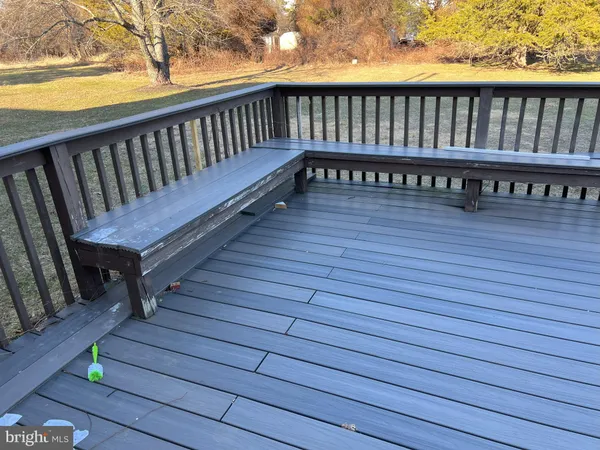 a view of balcony with wooden floor