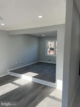 a stove top oven sitting inside of a kitchen