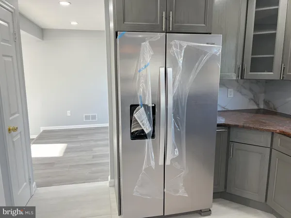 a kitchen with a sink cabinets and window