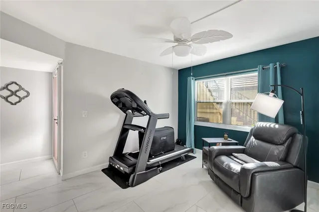 a view of a livingroom with furniture and a window