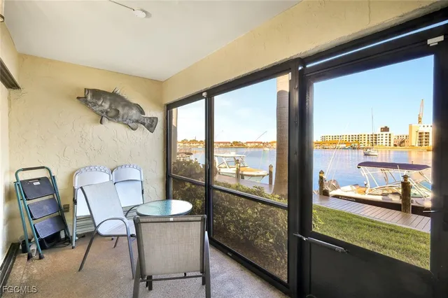 a view of a room with a table and chairs